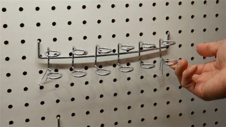 How do you keep Pegboard hooks from falling out?